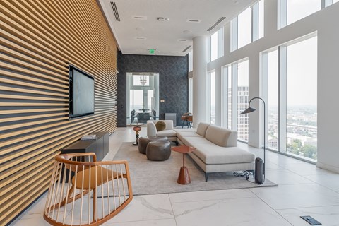 a living room with a white couch and a large window